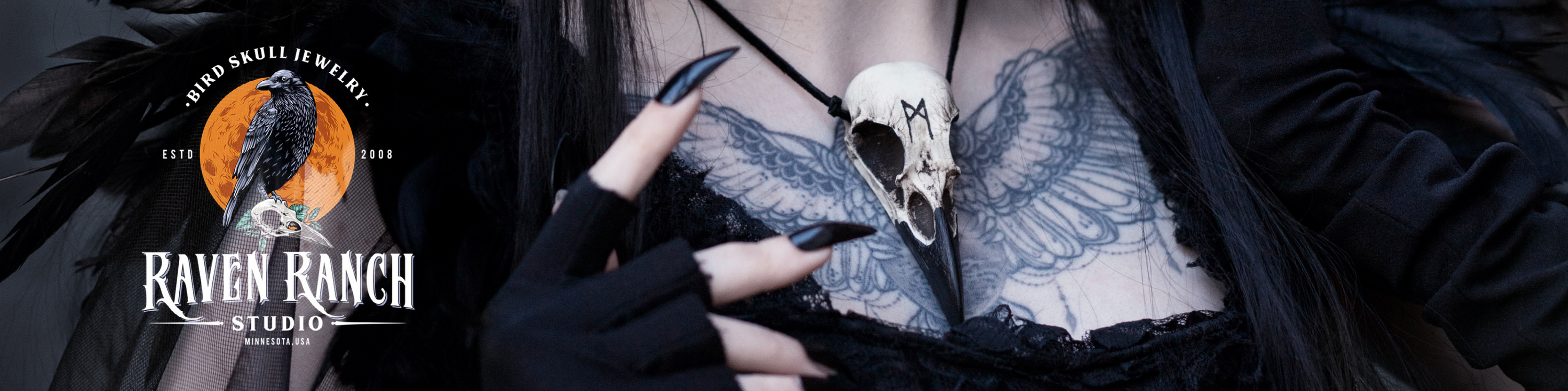Viking rune bird skull necklace on leather cord worn by gothic style raven skull jewelry model.