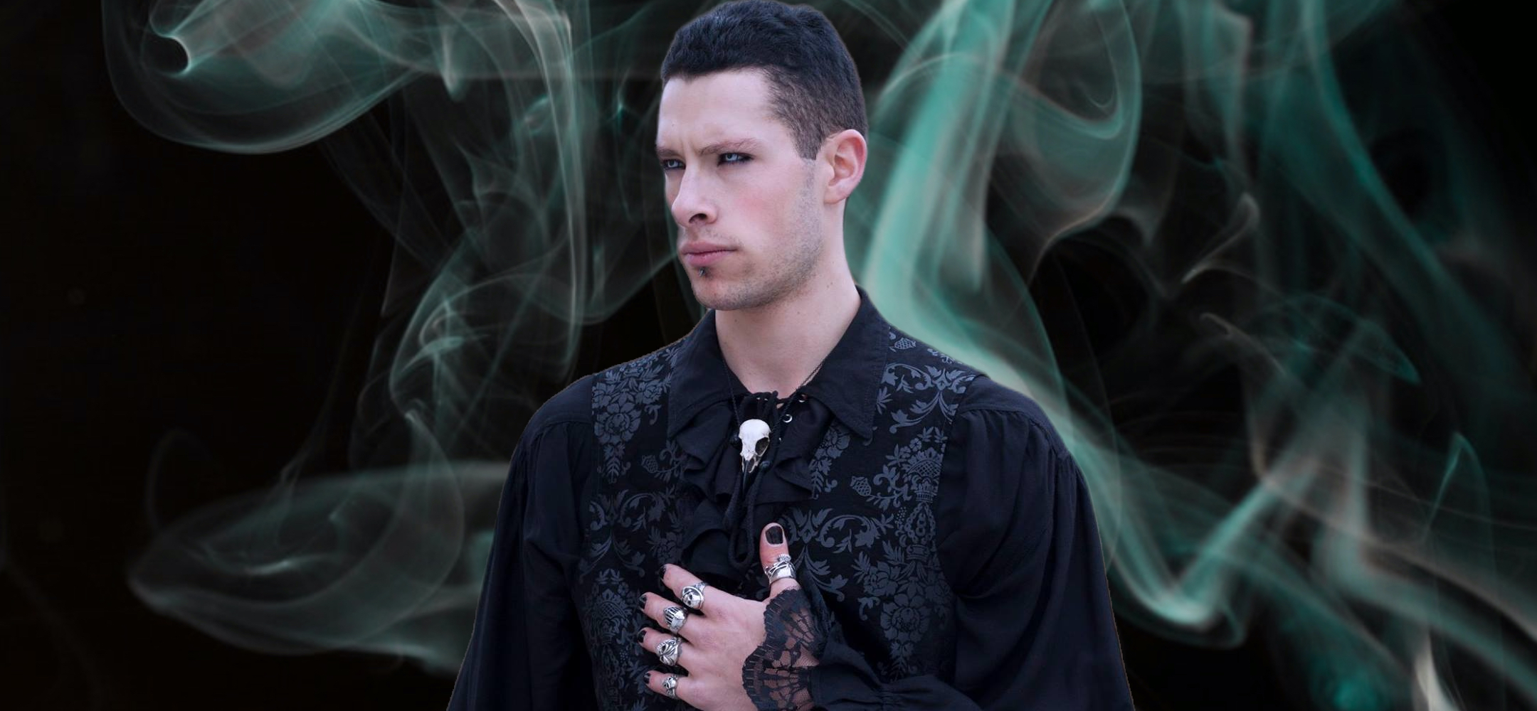 Raven skull necklace bird skull viking pendant made by Raven Ranch Studio, worn by gothic vampire model.