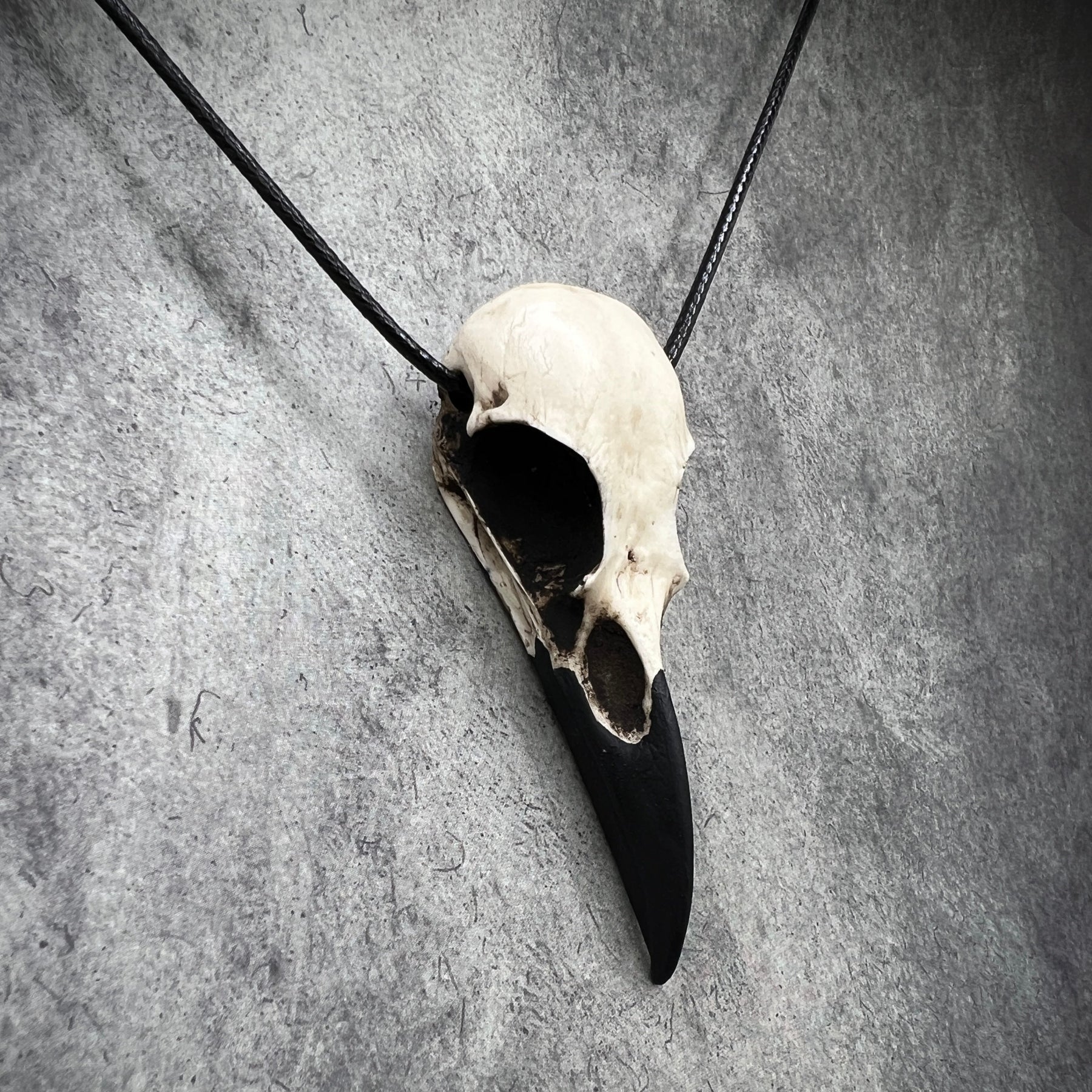 Skull festival necklace for dark creepy outfit goth style. A raven skull pendant made of resin.