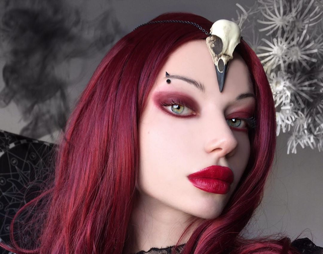 Crow skull necklace worn by bird skull jewelry queen