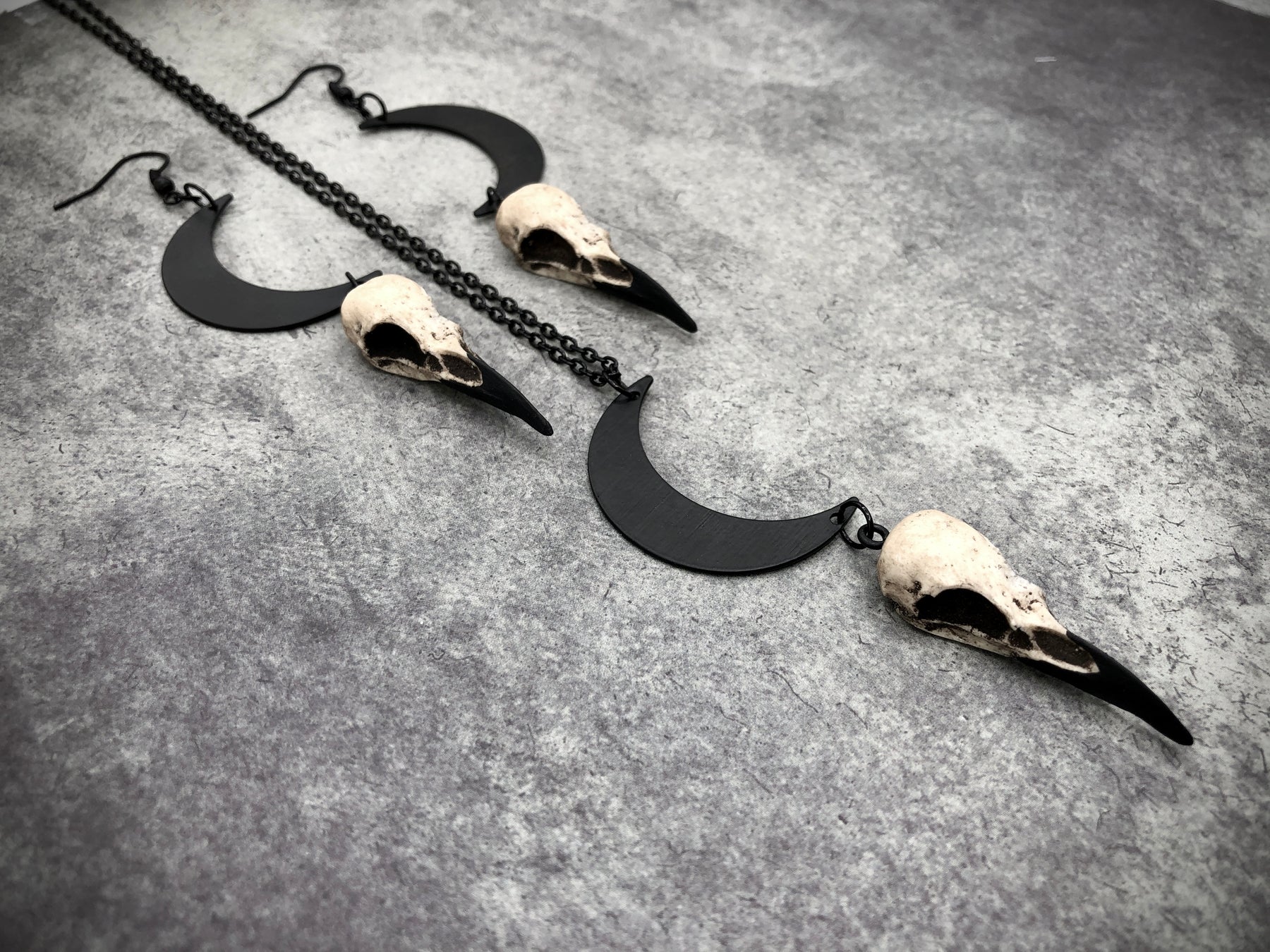 Goth gift idea bone jewelry necklace earring set of crescent waxing waning moon raven lunar charm and bird skull.
