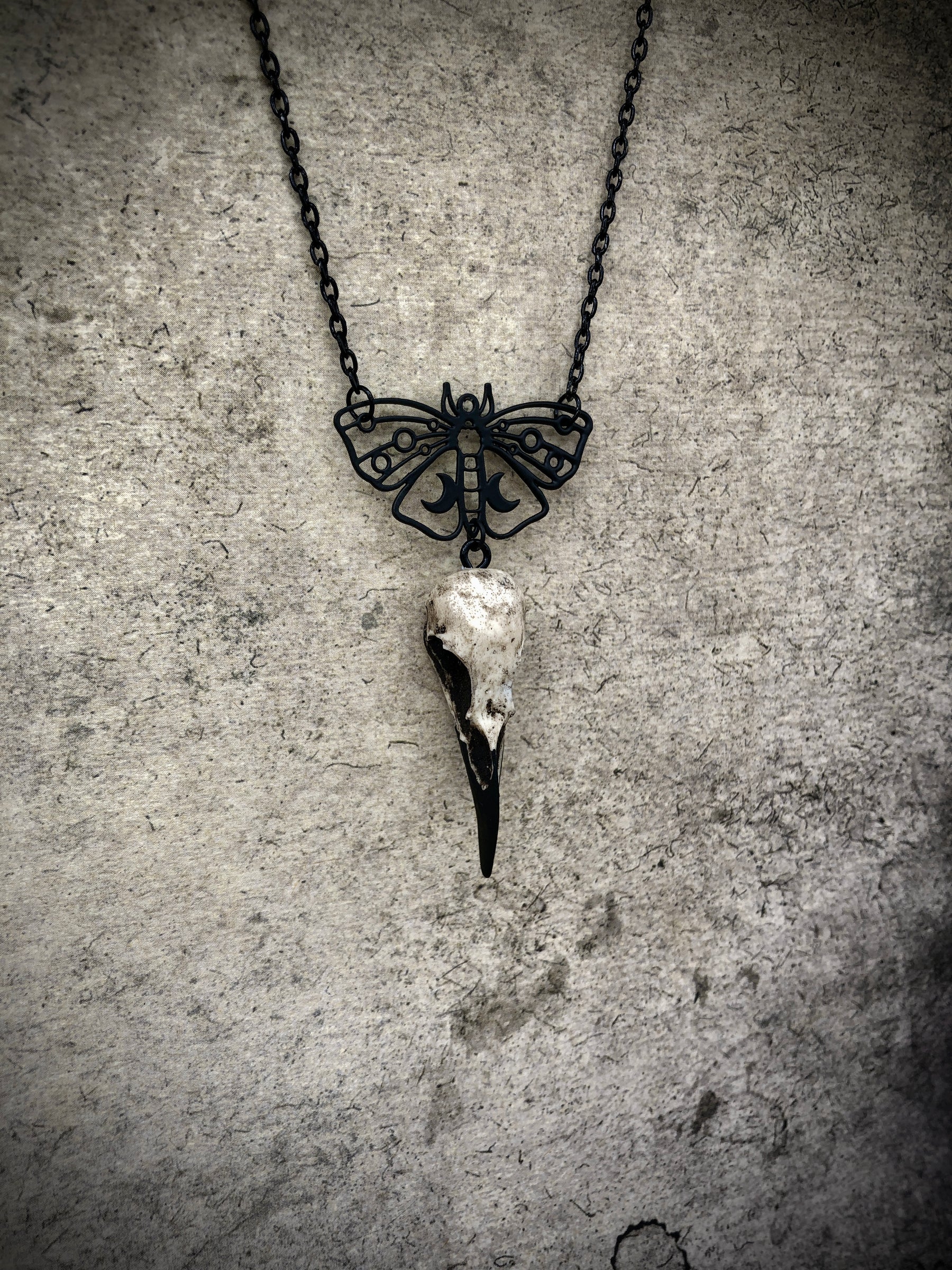 Death moth lunar butterfly charm pendant and bone jewelry mini raven skull dangle pendant by artist making resin bird skulls.