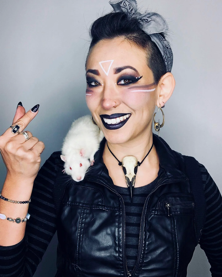 The highest quality handmade resin raven skull necklace pendant being worn by goth beauty. Bird skull jewelry made by Raven Ranch Studio.