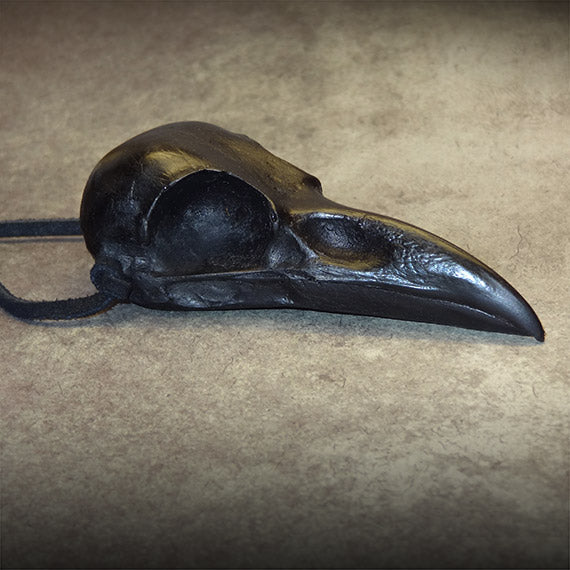 Halloween raven skull necklace pendant with a black suede cord handmade for witchy gothic statement bird skull jewelry.