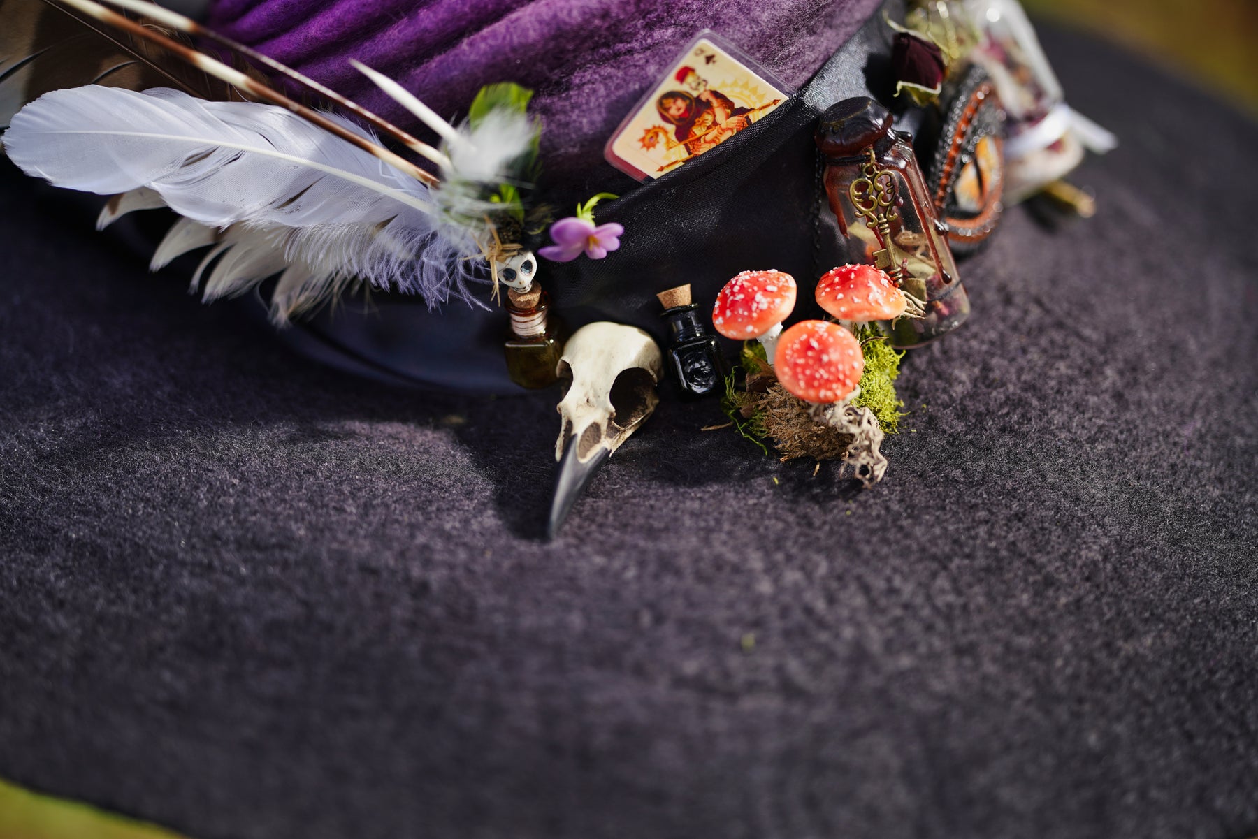 magical witch accessory cosplay ren faire hat close up showing a creepy unique bird skull raven hat pin brooch magpie.