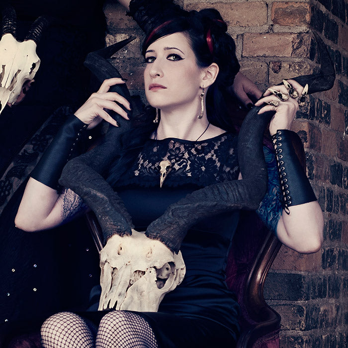 Unique and creepy bird skull necklace bone raven skull jewelry worn by gothic witchy woman.