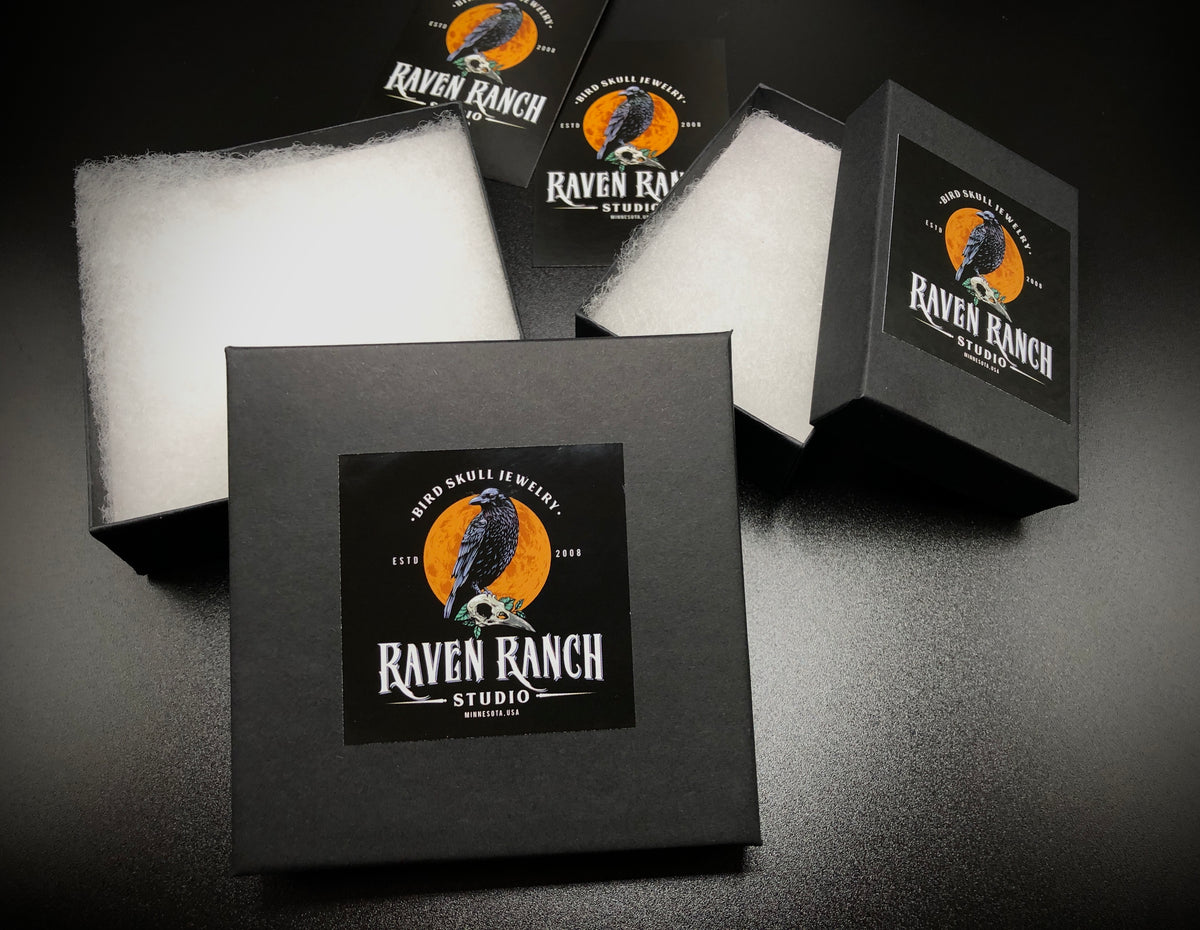 Raven Ranch Studio branded gift boxes that hold raven skull necklaces, bone jewelry, viking pendants and bird skull jewelry.