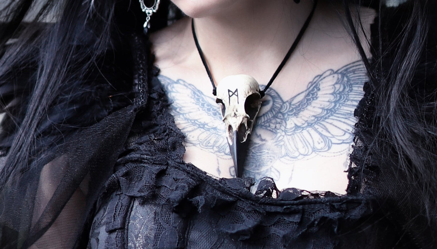 goth model with tattoo wearing raven skull necklace from raven ranch studio