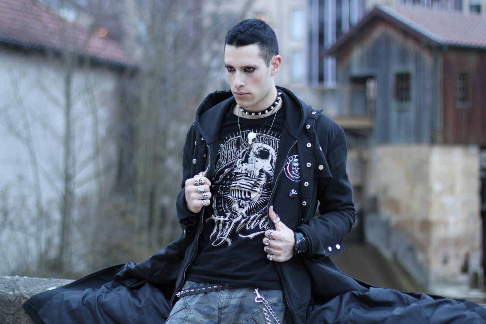 Raven skull necklace being worn by a man as gothic style jewelry