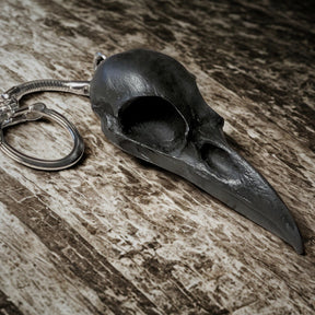 2.75 inch raven skull biker style keychain made of spooky black resin to look like a real bird skull key chain. 