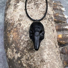 Forward view of a bone jewelry black resin rat skull necklace pendant for goths that love Halloween and taxidermy accessories.