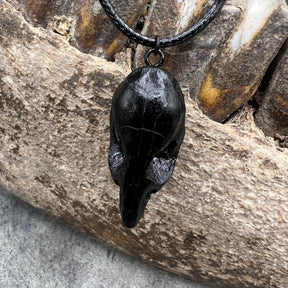 Skull view of a bone jewelry black resin rat skull necklace pendant for goths that love Halloween and taxidermy accessories.