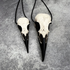 Large life size resin raven skull necklace pendant bone jewelry and a mini raven animal skull that are sold as a goth gift set for cosplay and LARP
