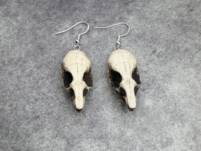 resin rat skull dangle earrings for goths that love bone jewelry, creepy accessories, witchy style and Halloween jewelry.