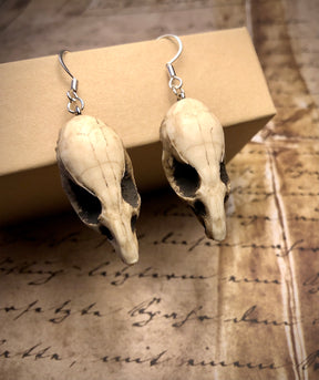 Aged finish resin rat skull dangle earrings for goths that love bone jewelry, creepy accessories, witchy style Halloween jewelry.