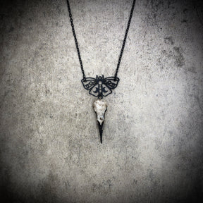 Delicate black Luna moth lunar butterfly charm pendant and bone jewelry mini raven skull dangle pendant by artist making resin bird skulls.