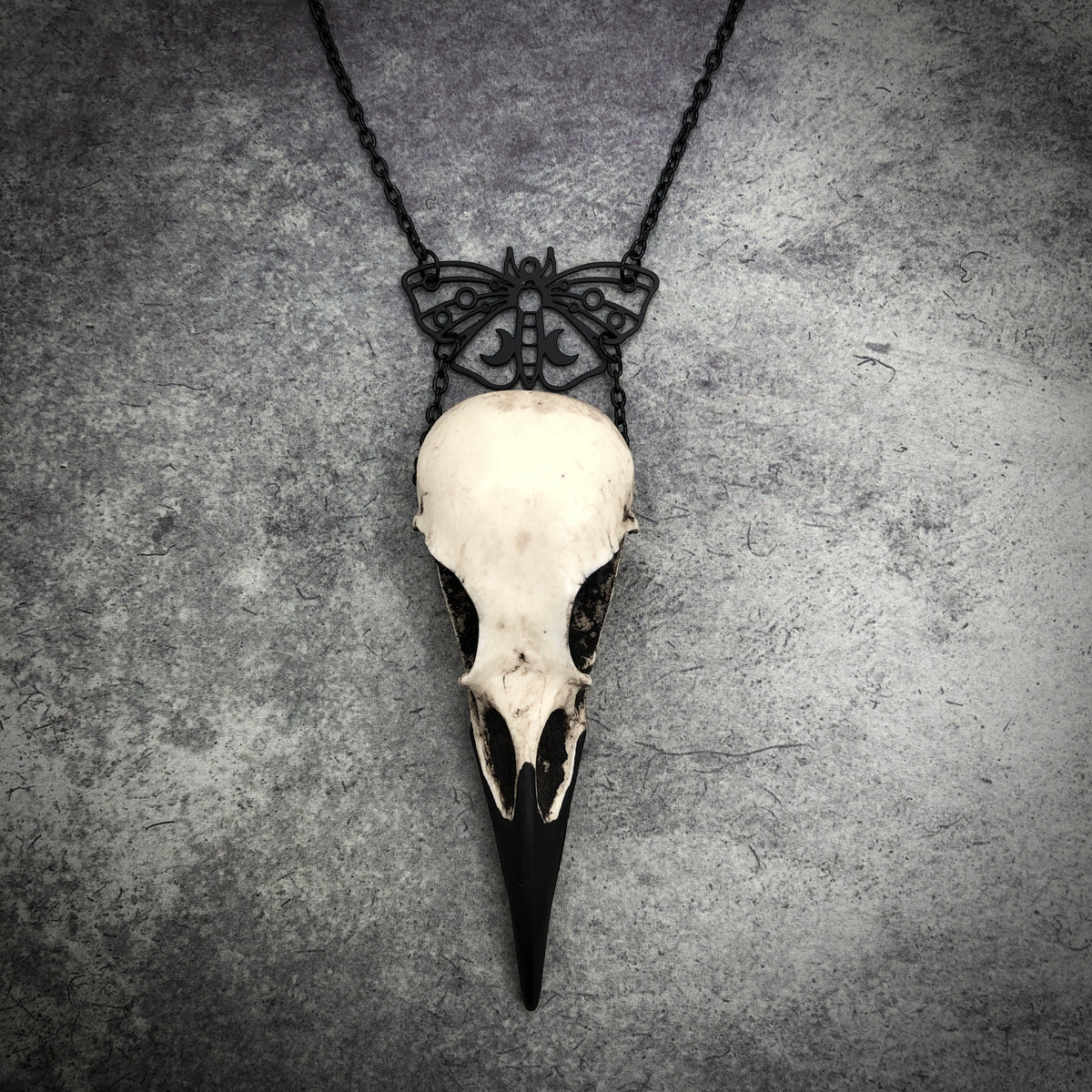 Witchy pagan black death moth luna butterfly charm pendant and bone jewelry mini raven skull dangle pendant by artist making resin bird skulls.
