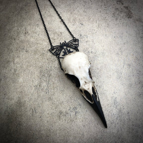 Gothic black butterfly charm pendant and bone jewelry mini raven skull dangle pendant by artist making resin bird skulls.