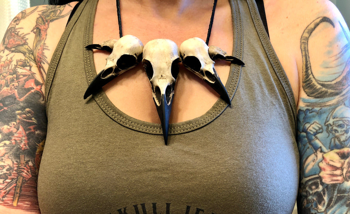 Multi skull Bone collector bird skull raven skull necklace pendant worn by bone jewelry gothic model with tattoos.