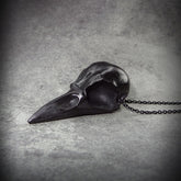 Black crow skull necklace bird skull jewelry for witchy gothic women or men that like creepy goth Halloween accessories.