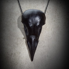 Black crow skull necklace bird skull jewelry for alt gothic women or men that like creepy witchy Halloween accessories.