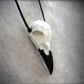 large life size natural white bone color raven skull necklace pendant with a black suede cord for Halloween costumes, ren faire and LARP.